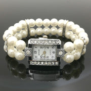 Reloj femenino de cuarzo con pulsera elástica de perlas vista frontal