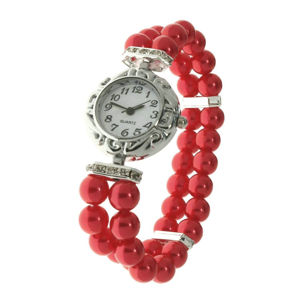 Reloj femenino con pulsera elástica en muñeca