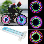 Luces LED para rueda de bicicleta en uso durante ciclismo urbano y nocturno, mostrando patrones brillantes multicolores en movimiento.