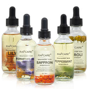 Set de aceites esenciales con pétalos naturales para cuidado corporal, incluye aromas como menta, azafrán y lirio para hidratación y brillo.