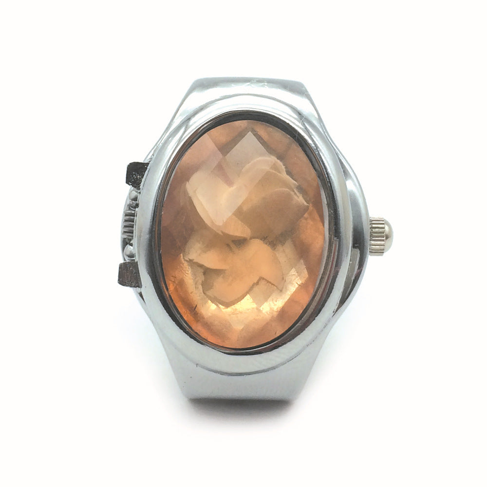 Reloj anillo con tapa abatible y cubierta tipo piedra en forma de flor