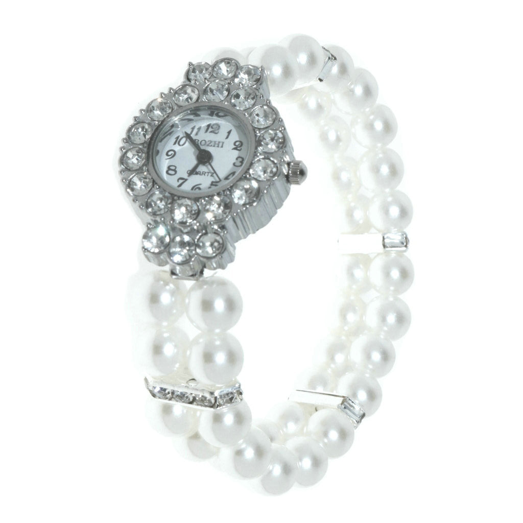 Reloj de mujer con dije de corazón y pulsera de perlas vista lateral