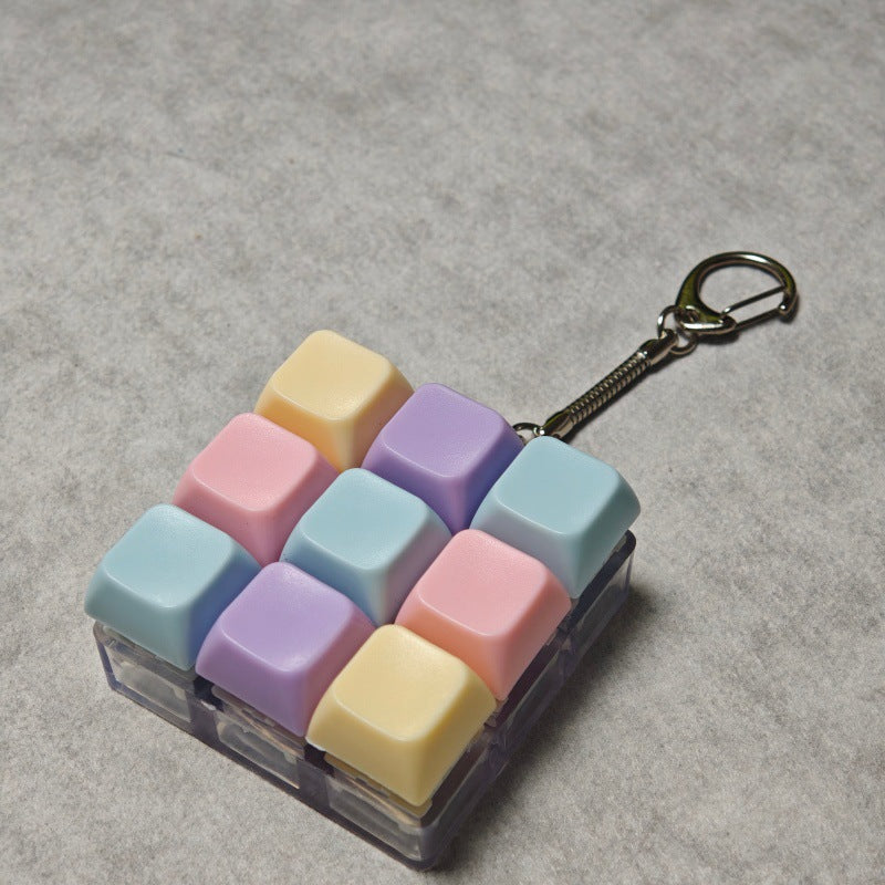 Llavero antiestrés de tecla de teclado macarón