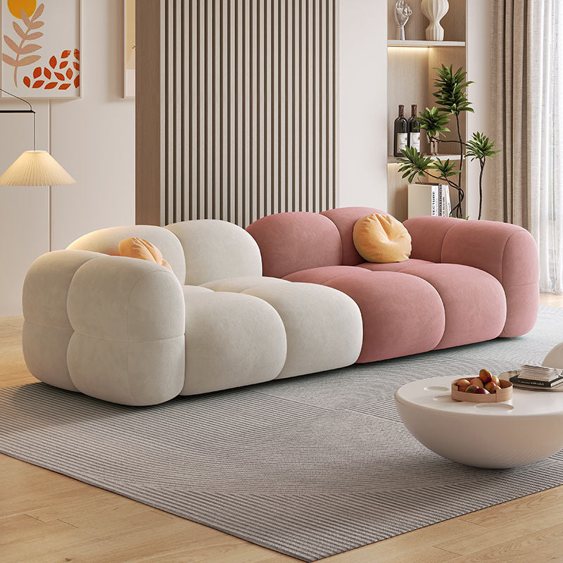Sofá modular estilo crema tapizado en terciopelo suave