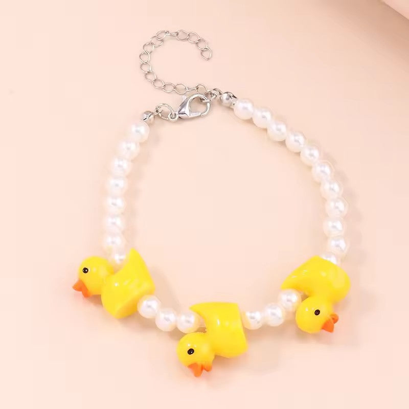 Set de Joyería Patito con Perlas | Aretes, Collar y Pulsera - 3