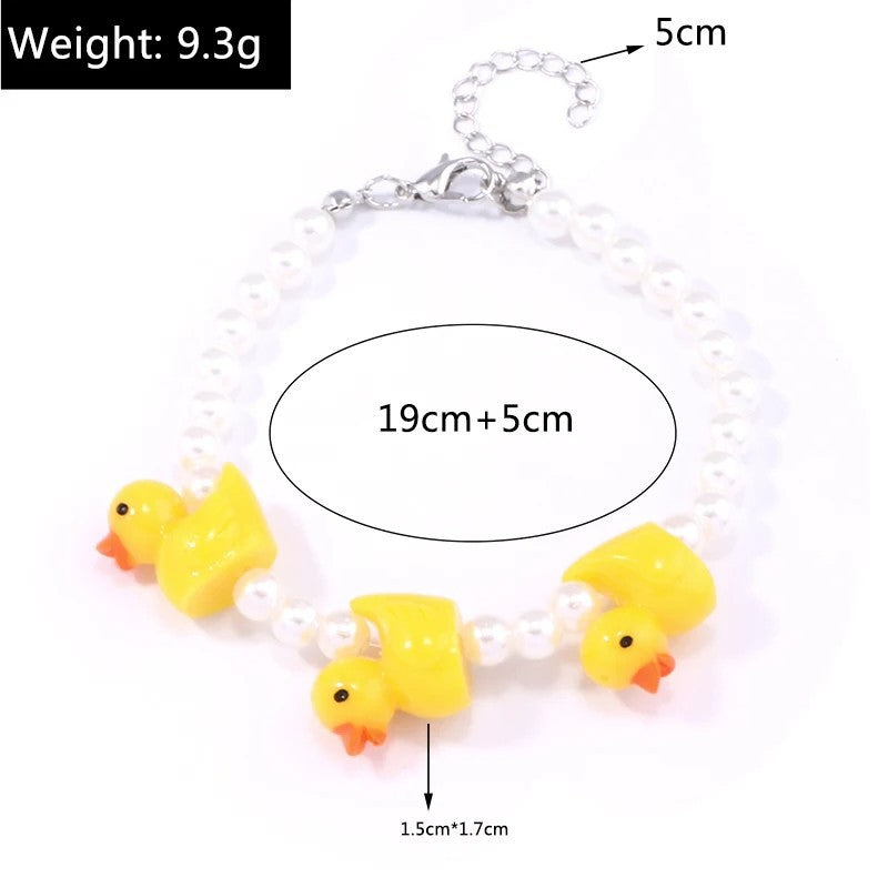 Set de Joyería Patito con Perlas | Aretes, Collar y Pulsera