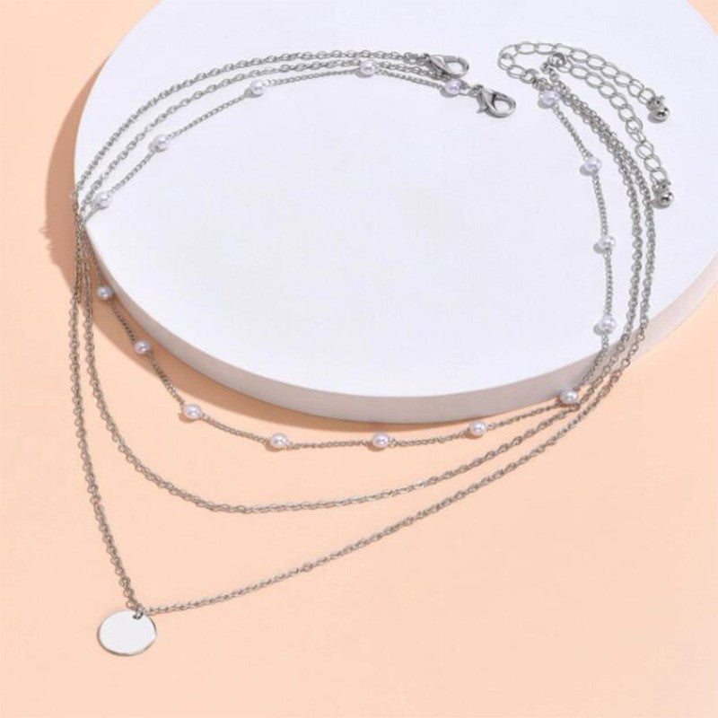 Collar con dije de corazón y perla