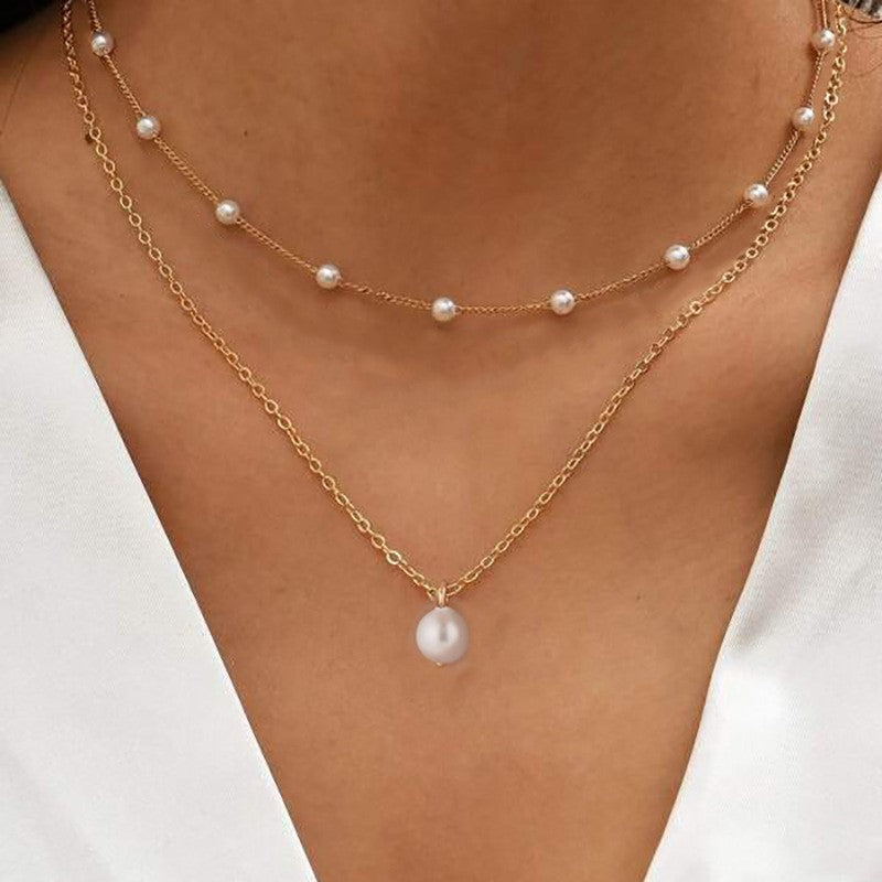 Collar con dije de corazón y perla