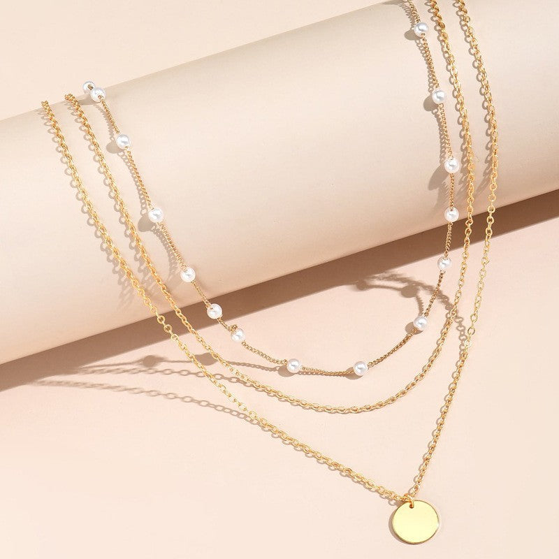 Collar con dije de corazón y perla