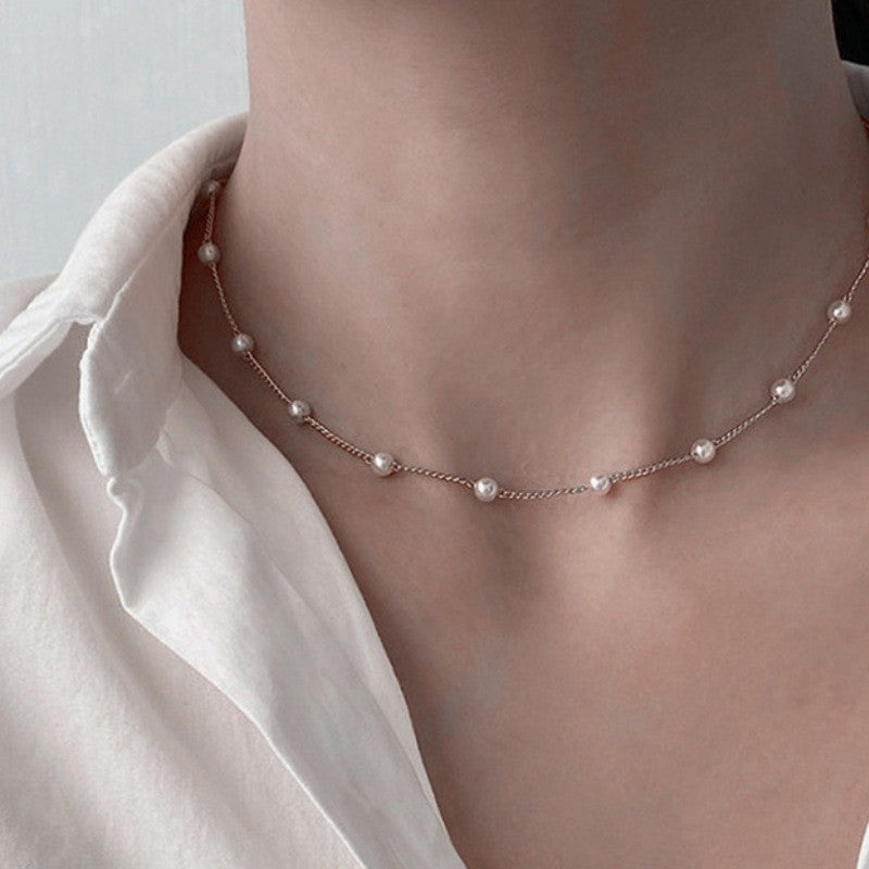 Collar con dije de corazón y perla