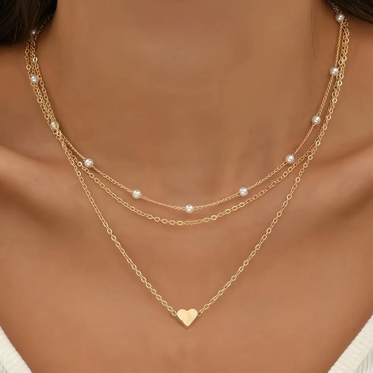 Collar con dije de corazón y perla