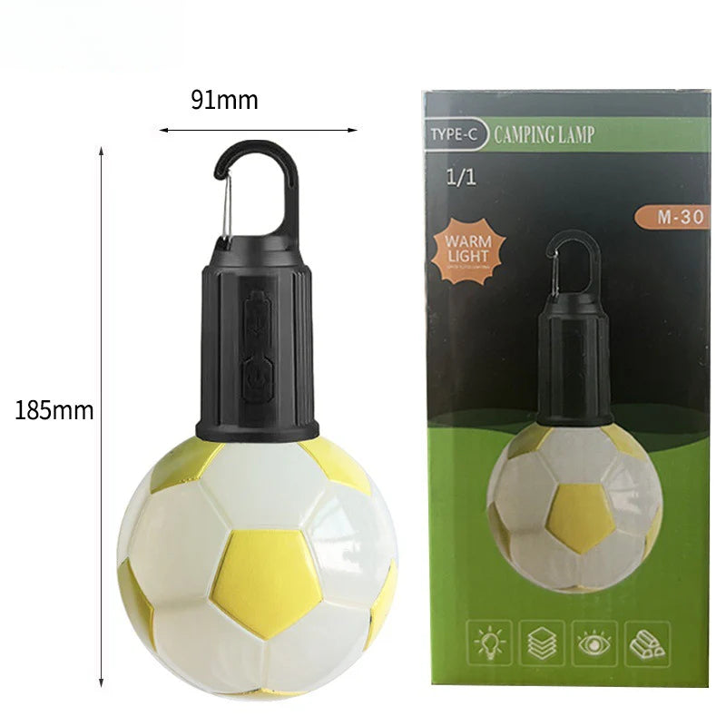 Luz LED balón de fútbol amarilla con empaque, recargable por Type-C, ideal para regalar a aficionados del fútbol y uso en exteriores.
