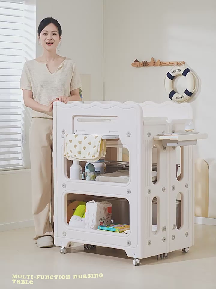 Load video: Mesa cambiadora multifuncional con almacenamiento para bebé