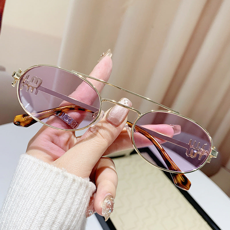 varimg:824712083430:armazon-dorado-con-lentes-morados